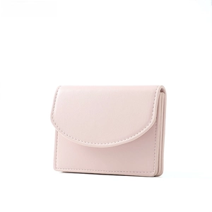 Close-up of light pink short wallet featuring accordion style card slots and fine stitching
