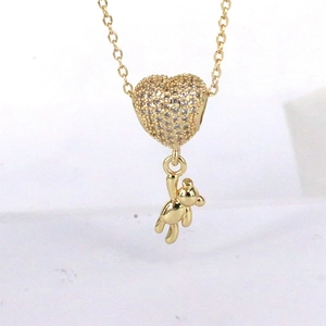 Golden necklace with heart-shaped zircon inlay and cute 3D bear pendant jewelry