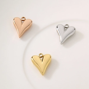 Polished stainless steel heart-shaped pendants in gold, rose gold, and silver finishes