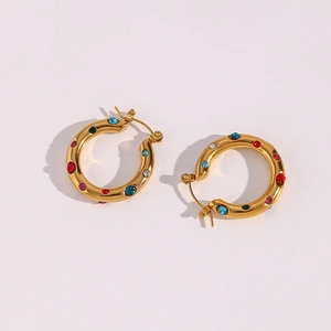 Detailed macro view of 18K gold plated hoop earrings with colorful zircon gemstones