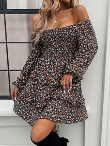 Detailed view of floral mini dress with smocked bodice and ruffled tiered skirt design