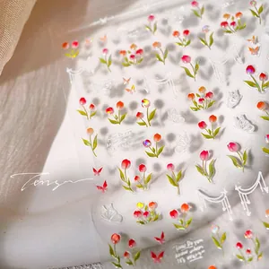 Detail of red tulip and butterfly 3D embossed nail art stickers with subtle glitter