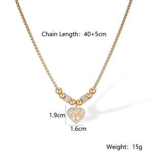 Detailed view of gold tree of life heart pendant with size measurements and weight