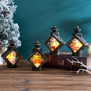 Close-up of vintage bronze Christmas lanterns with festive snowman and reindeer prints