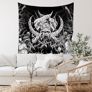 Detailed view of bohemian skull tapestry hanging on wall above a sofa in a living room