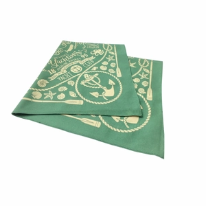 Detail of green cotton bandana with nautical digital print showing yachting motifs