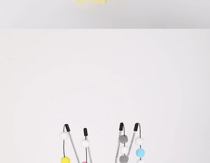 Detail of colorful macaron plush balls and glitter rods for interactive cat wands
