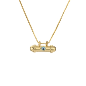 Macro detail of gold cylinder pendant with inlaid blue evil eye on square box chain
