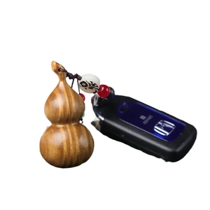 Handcrafted rosewood gourd keychain with brown braided cord and colorful beads