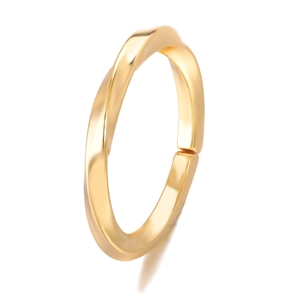 Detail of twisted gold ring with polished moebius texture and minimalist elegant design