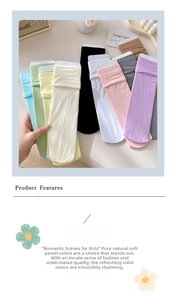 Macro display of assorted pastel velvet socks with cardboard packaging and retro props