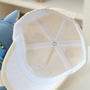 Detailed macro view of the breathable cotton lining and inner sweatband of the baby baseball cap