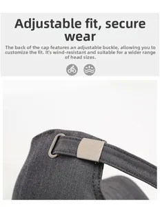Detail of adjustable metal buckle and cotton strap on a dark gray baseball cap for men