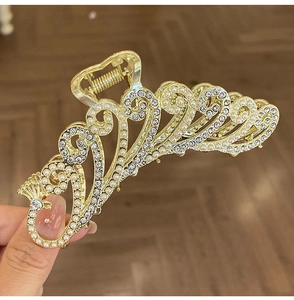 Detailed view of luxury 11cm gold metal hair claw clip with pearls and rhinestones