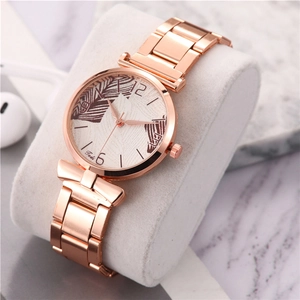 Fashionable rose gold ladies watch with mesh band and feather patterned dial