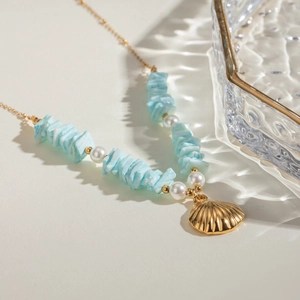 18k gold stainless steel necklace with mint green shell pieces and white pearls pendant