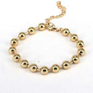 Minimalist adjustable gold beaded bracelet with lobster clasp and extension chain