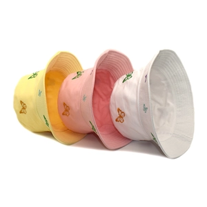 Reversible cotton bucket hats with colorful butterfly embroidery in yellow pink and white
