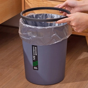Gray plastic garbage bin with pressure ring for kitchen waste management in home setting