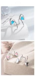 Detailed macro view of silver cat ear cuff with enamel drip oil in blue and pink