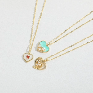 Elegant gold heart pendant necklace set with freshwater pearls and colorful enamel accents