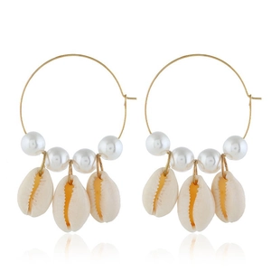 Golden hoop earrings with white pearls and natural beige shells on white background