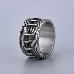 Macro view of dark silver wide punk ring with unique stitch texture and vintage finish
