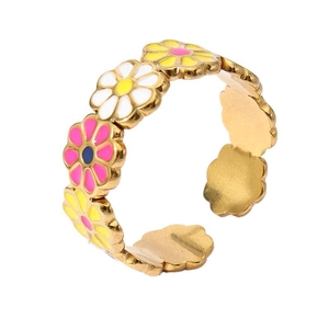 Detail of 18k gold plated open ring featuring colorful enamel daisy flower patterns