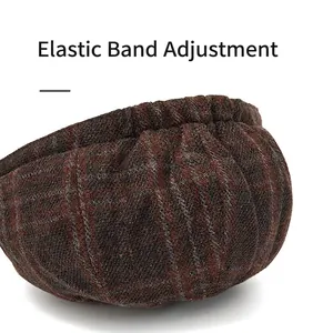 Brown plaid wool newsboy hat featuring an adjustable elastic band for a custom fit