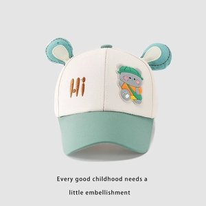 Detail of baby baseball cap with bear ears, HI embroidery, and green contrast brim
