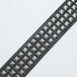 Punk style black leather belt featuring three rows of silver pyramid studs for women