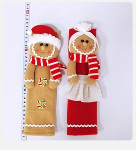 Detail of gingerbread man fridge handle covers with measuring tape for size scale