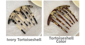 Close-up of cream and classic tortoiseshell acetate hair combs with seven teeth