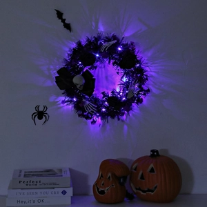 Halloween wreath with black tinsel, purple LED lights, skull and bones for door decor
