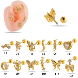 Detail of 12 gold cartilage studs featuring butterflies, hearts, and pearls with screw backs