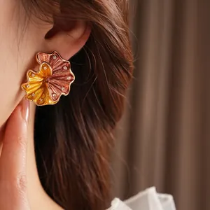 Vintage floral stud earring with yellow gradient enamel and sparkling crystal accents