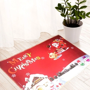 Festive red Christmas floor mat with Santa Claus pattern on light wood floor background
