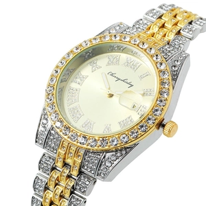 Detailed close-up of a luxury two-tone quartz watch dial with Roman numerals and crystals