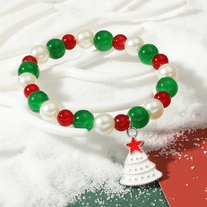 Christmas beaded bracelet featuring red, green and white pearls with a white tree pendant