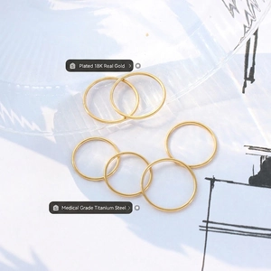 Minimalist 18K gold plated medical grade titanium steel rings in a polished round style