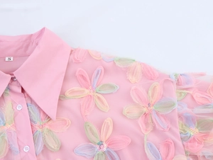 Detail of pink mesh shirt showing floral embroidery, sequins, and lapel collar size S