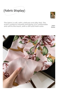 Detail of pink floral silk scarf featuring rose patterns and golden chain textures