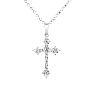 Macro shot of silver S925 cross pendant with sparkling clear cubic zirconia stones