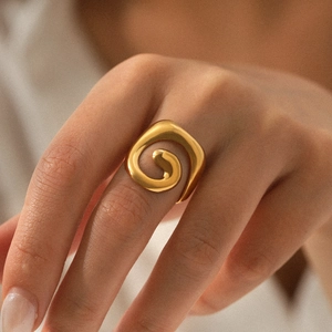 Modern 18K gold plated stainless steel open ring with a minimalist spiral twisted design