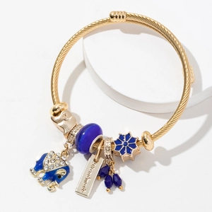 Adjustable stainless steel elephant charm bracelet with blue crystals and handmade tag