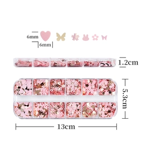 Close-up of 12-grid storage box with pink and gold butterfly heart nail sequins 13x5.3cm