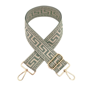 Detail of adjustable gray-green jacquard bag strap with Greek key pattern and gold buckles