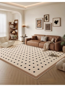 Detailed texture of the Caramel Wafer chenille rug with black checkered patterns and brown border
