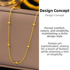 Close-up of 18K gold-plated stainless steel snake chain necklace with polished beads