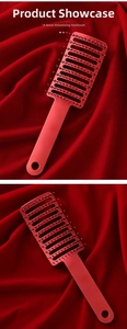 Detail of red vent hair brush with boar bristles and massaging tips for hair styling